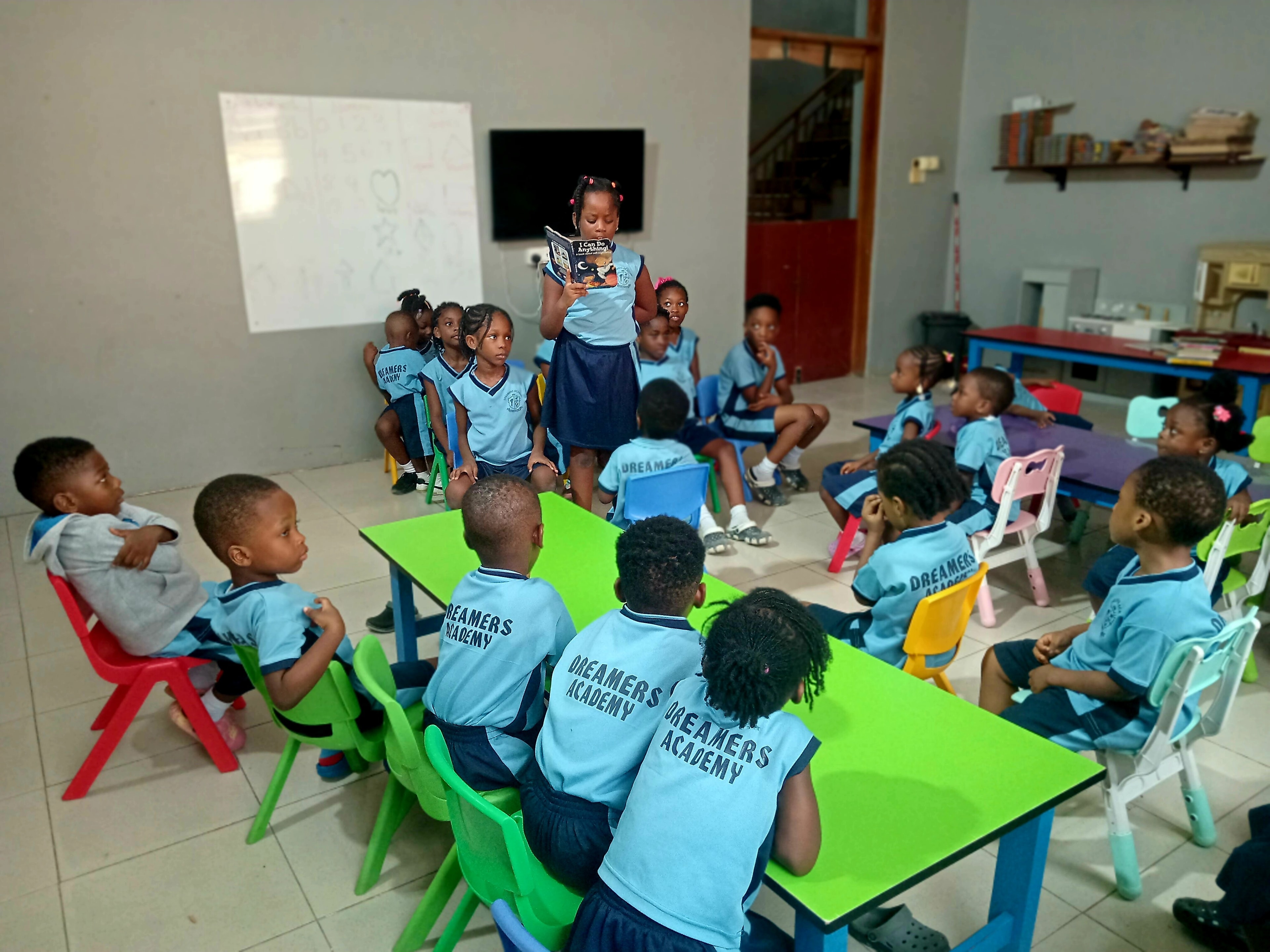 Dreamers Academy-GH students gathered for a classroom reading session